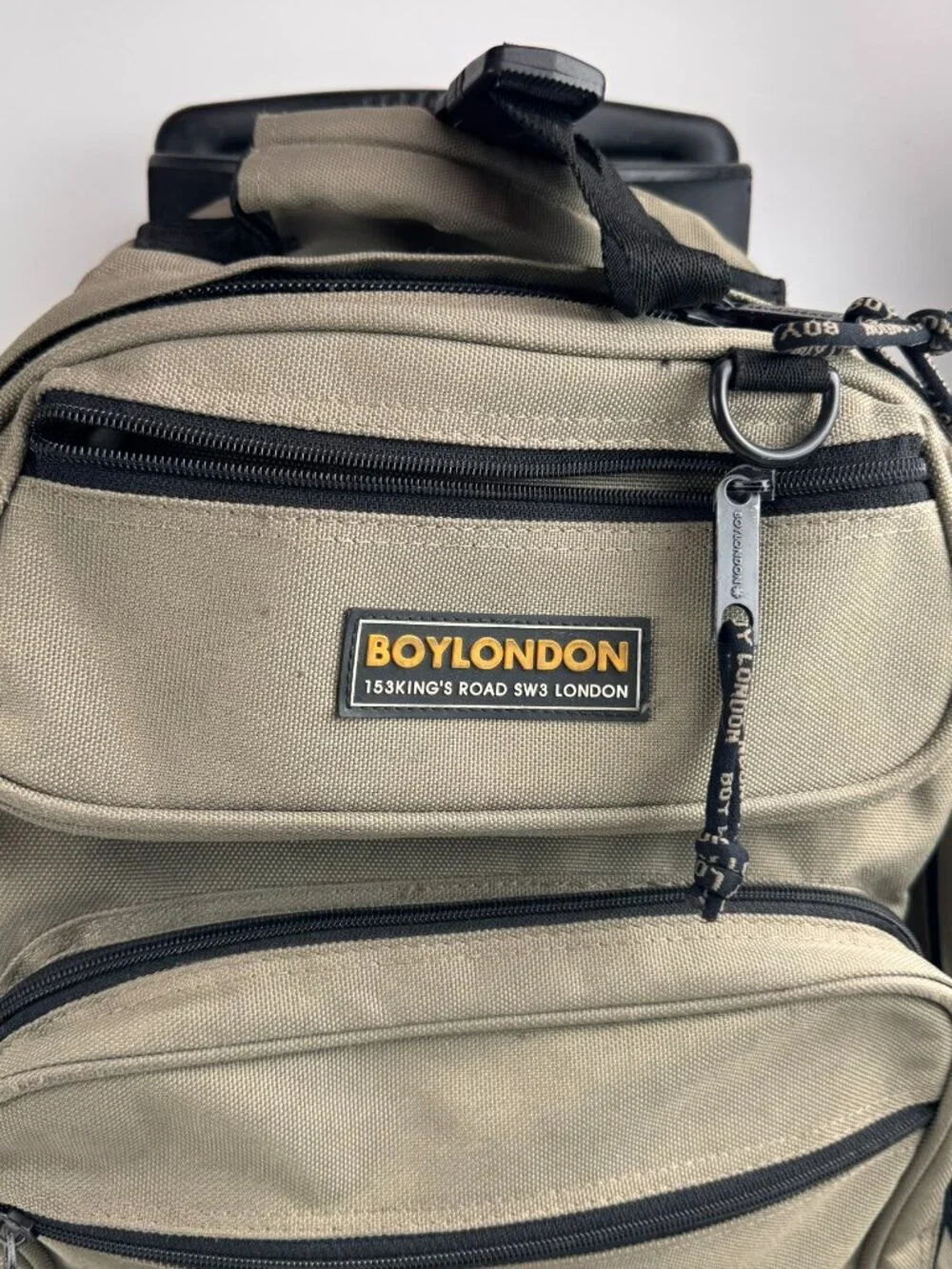 boy london rolling backpack tan wheeled suitcase travel bag tear fraying flaw